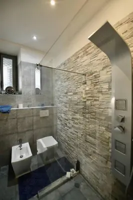 a bathroom with a sink and a toilet and a shower at The 150 Home - Homkeey Apartments in Rome