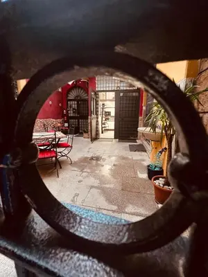 a view of a patio through a chain link fence at Leopardi House 3 in Rome