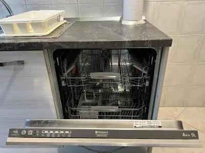 a dishwasher with a cage full of dishes in it at Triade Home in Rome