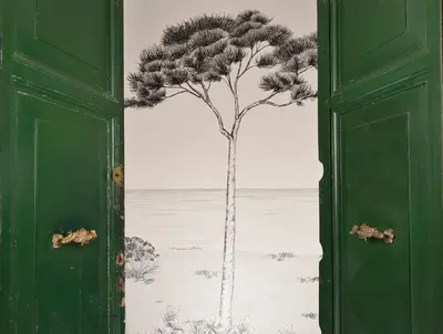 a painting of a tree on a wall at Palazzo Tridente Rooms in Rome