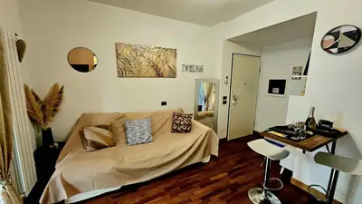 a bedroom with a bed and a table in it at Dream Home Cortina in Rome