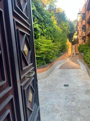 an open door to a hallway with a sidewalk at Dream Home Cortina in Rome