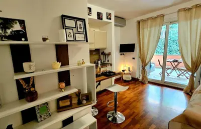 a living room with white shelves and a desk at Dream Home Cortina in Rome