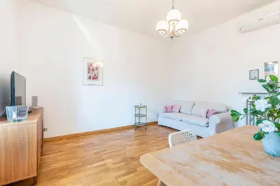 a living room with a table and a couch at Dome At Home in Rome