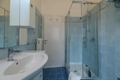 a bathroom with a tub and a sink and a shower at Da Renny in Rome