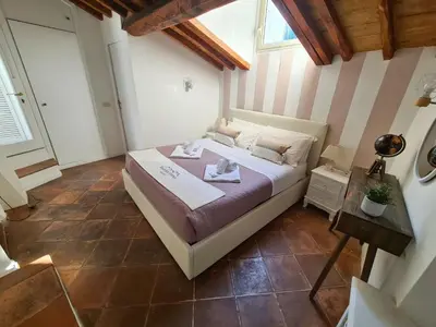 a bedroom with a large bed in a room at Boutique Domus Spagna Ripetta in Rome
