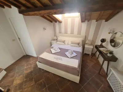 a bedroom with a bed with two dishes on it at Boutique Domus Spagna Ripetta in Rome