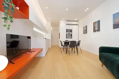 a living room with a couch and a table and chairs at 4BNB - Charming Giuliana Apartment in Rome