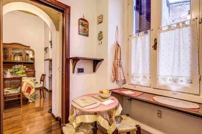 a small room with a table and a window at Feffyhouse in Rome