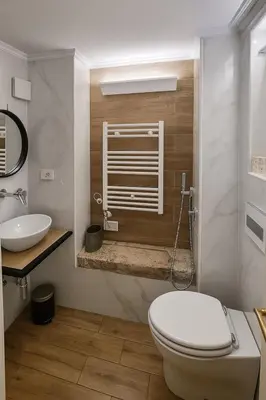 a bathroom with a toilet and a sink at éROMA - NAVONA Apartment in Rome