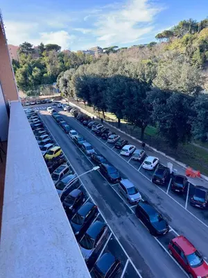 an overhead view of a parking lot with cars parked at Aurelio Vatican Apartment in Rome
