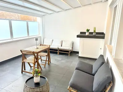 a living room with a couch and a table at Saint Peter Rome - Luxury Apartments with 24H Guarded Parking in Rome
