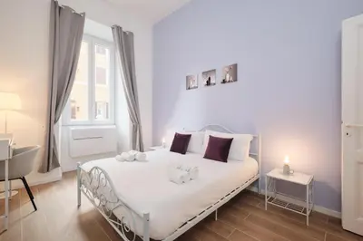 a bedroom with a bed with two stuffed animals on it at Vatican Museums - Modern flat with Wi-Fi & Netflix in Rome