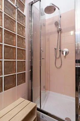 a bathroom with a shower with a glass door at Stella House in Rome