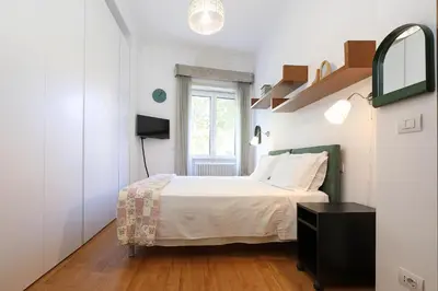 a small bedroom with a bed and a window at Stella House in Rome