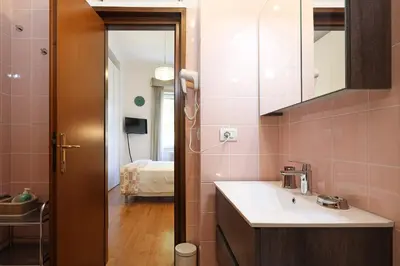 a bathroom with a sink and a mirror at Stella House in Rome