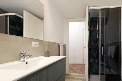 a bathroom with a sink and a shower at Bologna GARDEN HOUSE in Rome