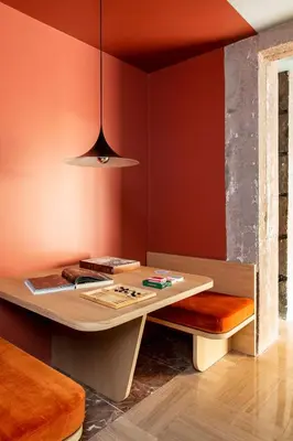 a dining room with a table and a bench at ATEL Relais in Rome