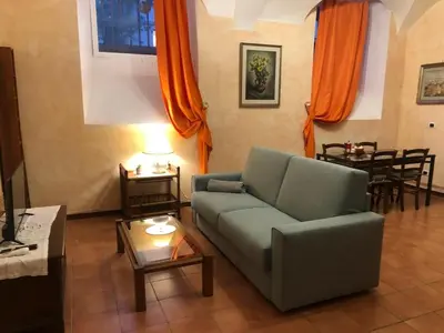 a living room with a couch and a table at Luminosa e accogliente casa Centro Storico in Rome