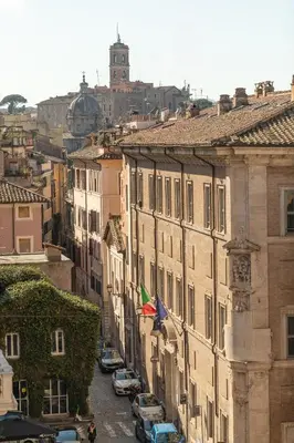 a view of a city street with buildings and cars at Casa Maestro, a Burghesius home in Rome