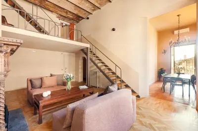 a living room with a couch and a table at Casa Maestro, a Burghesius home in Rome