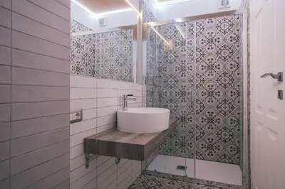 a bathroom with a sink and a shower at SuiteFrattini degli Eroi in Rome