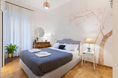 a bedroom with a bed with two towels on it at Kenzia Suite Aventino in Rome