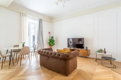 a living room with a couch and a table at iFlat Stylish & Cozy apt in the Heart of Monti in Rome