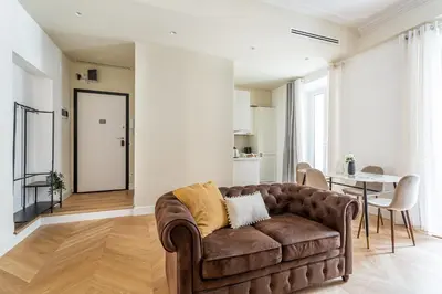 a living room with a couch and a table at iFlat Stylish & Cozy apt in the Heart of Monti in Rome