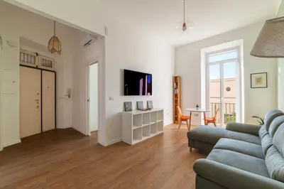a living room with a couch and a table at GuestHost - Roma San Lorenzo Apartment in Rome