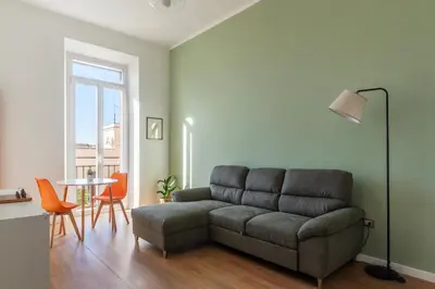 a living room with a couch and a table at GuestHost - Roma San Lorenzo Apartment in Rome