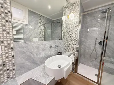 a bathroom with a sink and a shower at Villa Angela in Rome