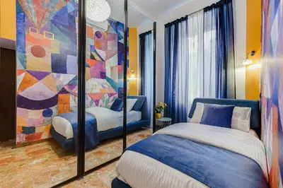 a bedroom with a bed and a large painting at BDC - Galatea Art Gallery 3BDR at Testaccio in Rome