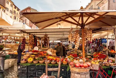 a market with a bunch of fruits and vegetables at Authentic Central Roman Home - Metro 7min, 5min to Rome Center, AC, Wi-Fi in Rome