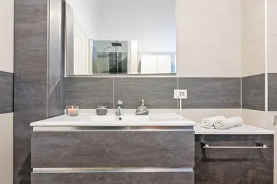 a bathroom with a sink and a mirror at Blu Colombo in Rome