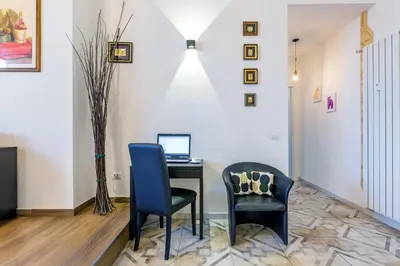 a living room with a television and a couch at Blu Colombo in Rome
