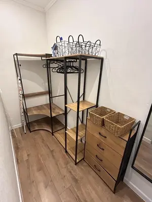 a room with a shelf with several baskets on it at laurus's house in Rome