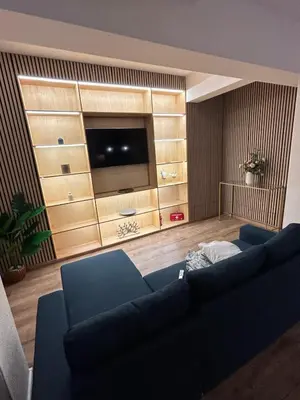 a living room with a couch and a flat screen tv at laurus's house in Rome