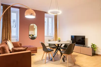 a living room with a couch and a table at Pallaro 6 Apartment in Rome