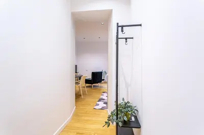 a hallway with a door leading to a dining room at iFlat Monti Brand New Peaceful Apartment in Rome