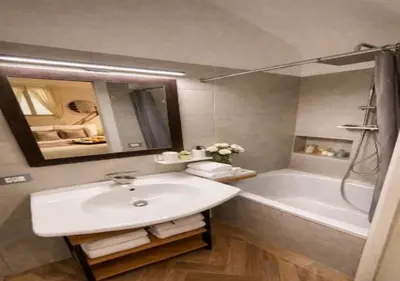 a bathroom with a sink and a tub and a mirror at Vatican Prestige Suite 