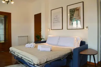 a bed in a room with two towels on it at Attico Aurelia Antica in Rome
