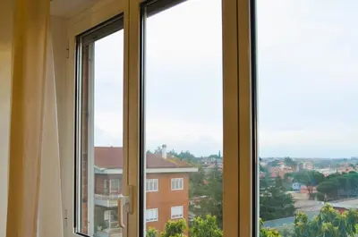 a window with a view of a city at Attico Aurelia Antica in Rome