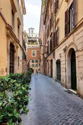 an empty street in an alley between buildings at Domus Greci Piazza di Spagna in Rome