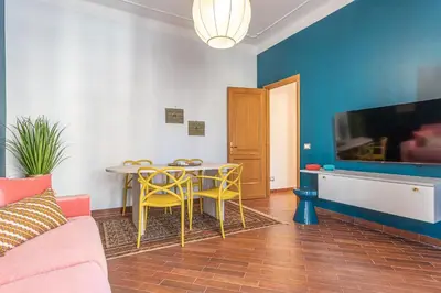 a living room with a table and a tv at YCH-Unique apartment near Vatican in Rome