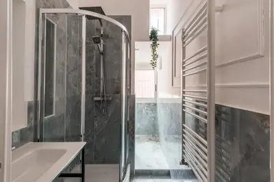 a bathroom with a shower and a sink at The Best Rent - Spacious multi-room apartment on Via Cavour in Rome