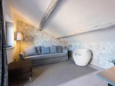 a living room with a couch and a table at Central Rome Terrace Apartment in Rome