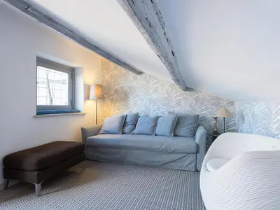 a living room with a couch and a chair at Central Rome Terrace Apartment in Rome