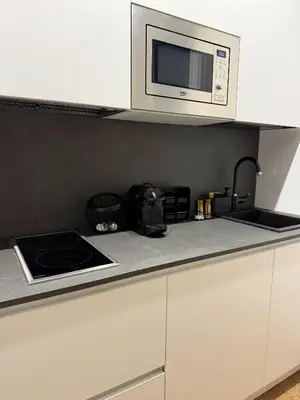 a kitchen with a microwave and a counter top at Sweet Life Monteverde in Rome