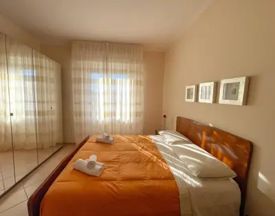 a bedroom with a bed with two stuffed animals on it at MARIA TERESA Apartment - Sophisticated Living and City Links - Quartiere TRIESTE in Rome